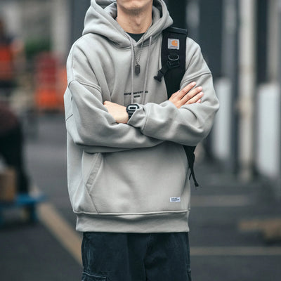 Plus Size Harajuku High Quality Thin Couple Pullover in gray worn by a person with a backpack.