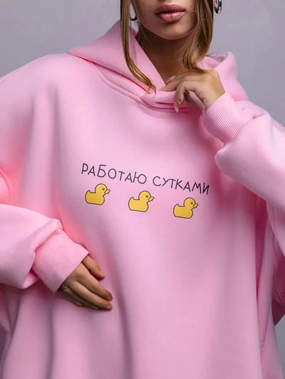 Unisex oversized hoodie in pink with duck graphic and text, perfect for casual streetwear, oversized hoodie warm sweatshirt.